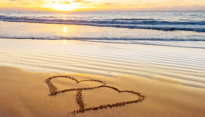 Couple hearts on sea beach