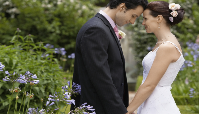 bride and groom getting married in garden